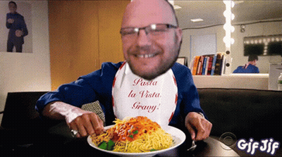 A Man Wearing A Bib That Says " Pasta La Vista Grany " Is Eating Spaghetti GIF