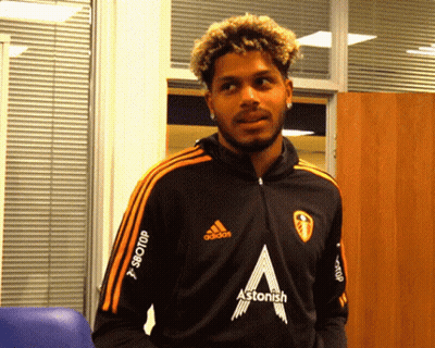 A Man Wearing A Black Adidas Jacket With The Word Astonish On The Front GIF