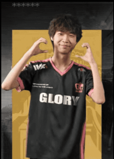 A Man Wearing A Black And Pink Glory Jersey Makes A Heart Shape With His Hands GIF
