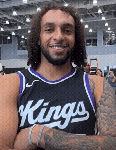 A Man Wearing A Black And Purple Jersey That Says Kings GIF