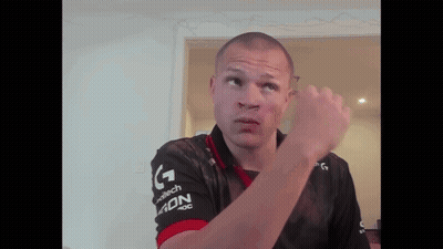 A Man Wearing A Black And Red Shirt That Says Adn GIF
