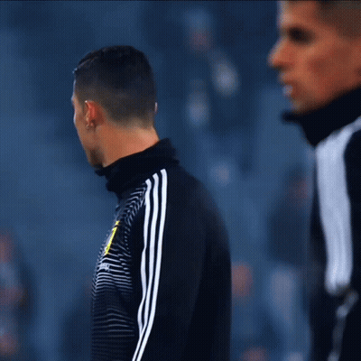 A Man Wearing A Black And White Striped Shirt With The Letter J On It GIF