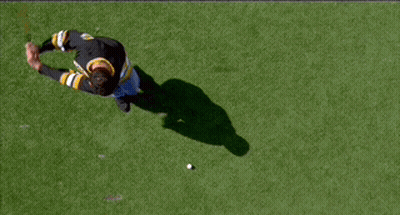 A Man Wearing A Black And Yellow Jersey With The Letter B On The Front GIF