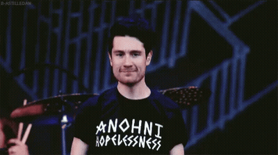 A Man Wearing A Black Anohni Hopelessness Shirt GIF