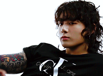 A Man Wearing A Black Calvin Klein Jeans Shirt GIF