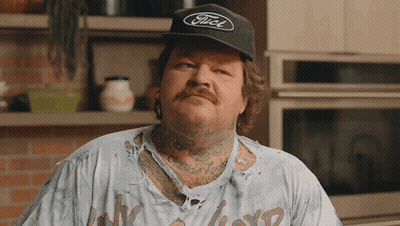 A Man Wearing A Black Ford Hat And A Dirty Shirt GIF