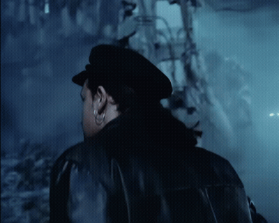 A Man Wearing A Black Hat And A Black Jacket GIF