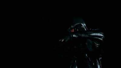 A Man Wearing A Black Hat And A Black Jacket GIF
