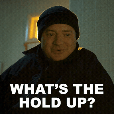 A Man Wearing A Black Hat And A Black Jacket Says What 'S The Hold Up GIF