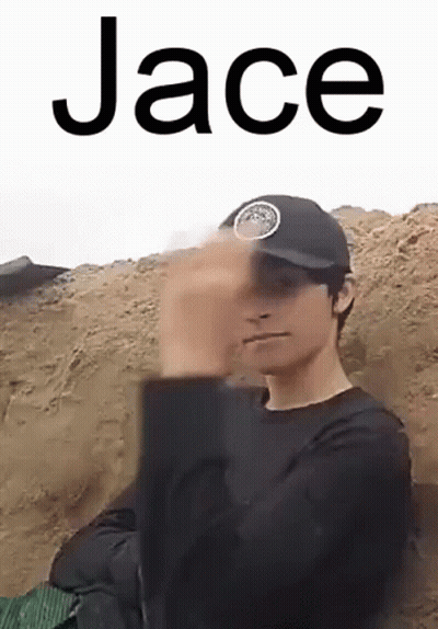 A Man Wearing A Black Hat And A Black Shirt Is Making A Funny Face . GIF
