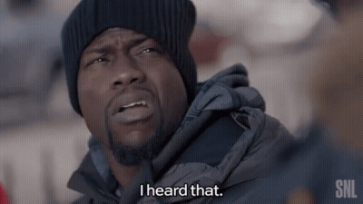 A Man Wearing A Black Hat And A Grey Jacket Says I Heard That GIF