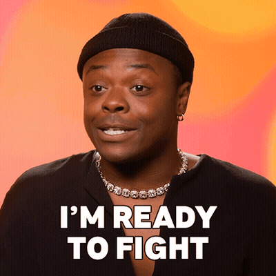 A Man Wearing A Black Hat And A Necklace Says I 'M Ready To Fight GIF