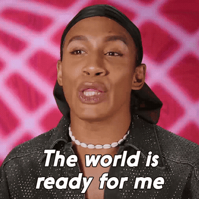 A Man Wearing A Black Hat And A Pearl Necklace Says The World Is Ready For Me GIF
