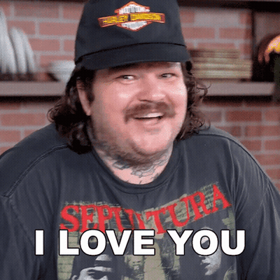 A Man Wearing A Black Hat And A Shirt That Says I Love You GIF
