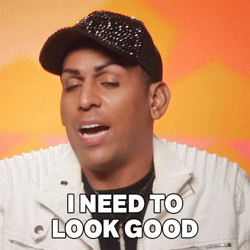 A Man Wearing A Black Hat And A White Jacket Says I Need To Look Good GIF