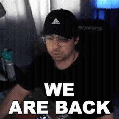 A Man Wearing A Black Hat And Glasses Says We Are Back GIF