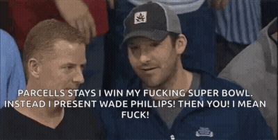 A Man Wearing A Black Hat Is Talking To Another Man GIF