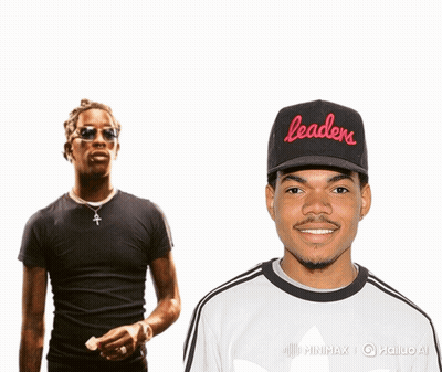 A Man Wearing A Black Hat That Says Leaders Stands Next To Another Man GIF