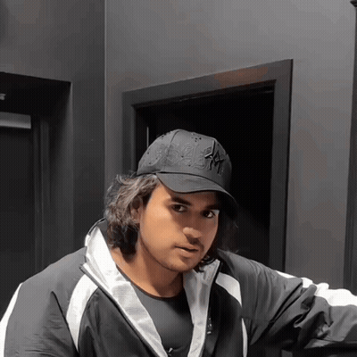 A Man Wearing A Black Hat That Says Ny GIF