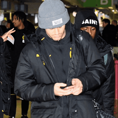 A Man Wearing A Black Hat That Says Saint On It GIF