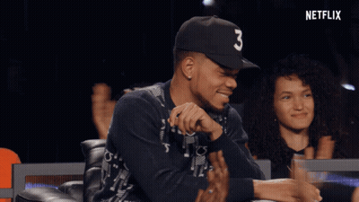 A Man Wearing A Black Hat With The Number Three On It GIF