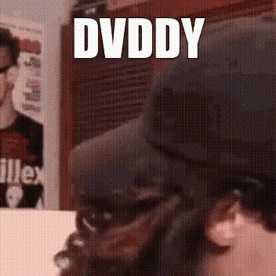 A Man Wearing A Black Hat With The Word Dvddy On It GIF