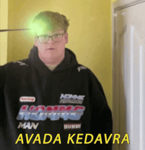 A Man Wearing A Black Hoodie That Says Avada Kedavra On It GIF