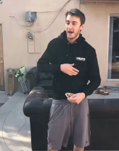A Man Wearing A Black Hoodie That Says " Collett " GIF