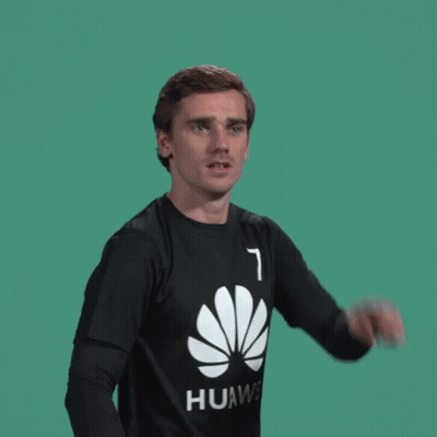 A Man Wearing A Black Huawei Shirt Is Pointing GIF