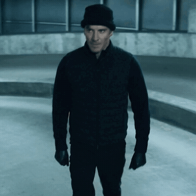 A Man Wearing A Black Jacket And A Black Hat GIF