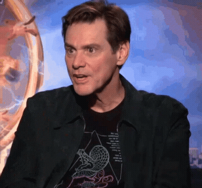 A Man Wearing A Black Jacket And A Black T-Shirt With A Drawing Of A Snake On It GIF