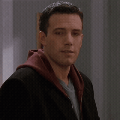 A Man Wearing A Black Jacket And A Red Hooded Sweatshirt GIF