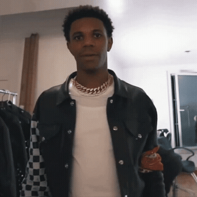 A Man Wearing A Black Jacket And A White Shirt GIF