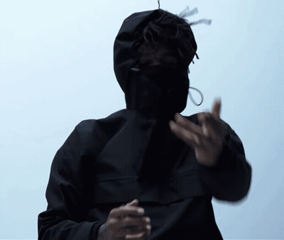 A Man Wearing A Black Jacket With A Hood On His Face GIF