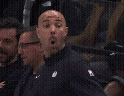 A Man Wearing A Black Jacket With A Nba Logo On The Sleeve GIF