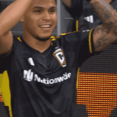 A Man Wearing A Black Jersey That Says Nationwide GIF
