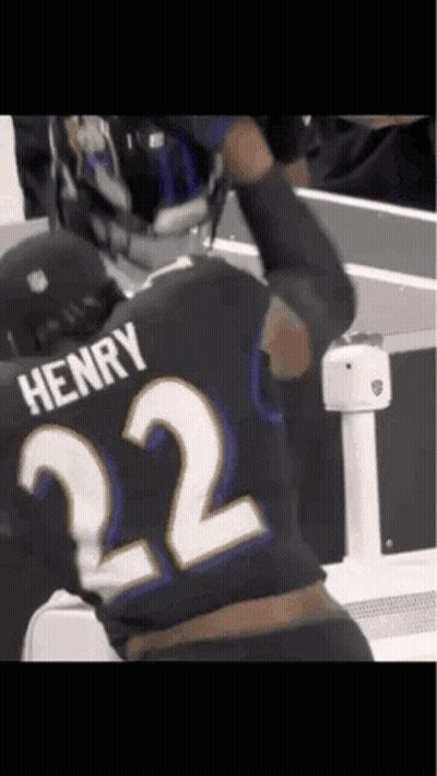 A Man Wearing A Black Jersey With The Number 22 On It GIF