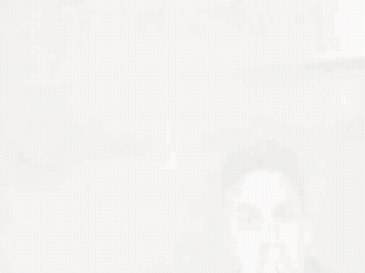 A Man Wearing A Black Leather Jacket Is Covering His Mouth GIF