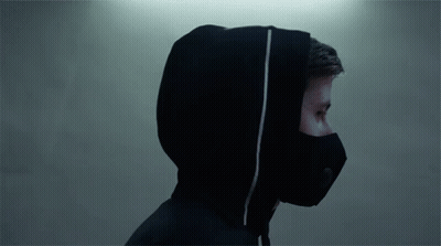 A Man Wearing A Black Mask And A Hooded Jacket GIF