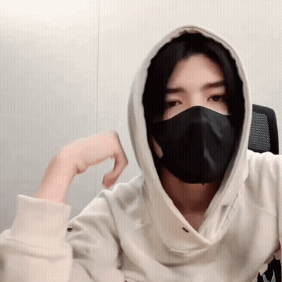 A Man Wearing A Black Mask And A Hoodie GIF