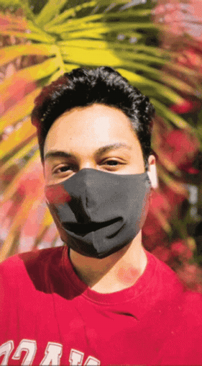 A Man Wearing A Black Mask And A Red Shirt That Says ' Uc San Diego ' On It GIF