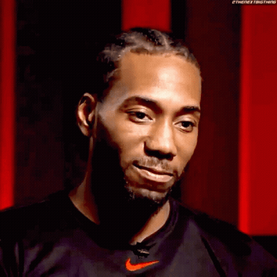 A Man Wearing A Black Nike Shirt Is Smiling With His Eyes Closed . GIF