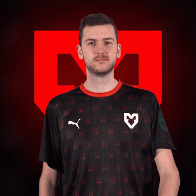 A Man Wearing A Black Puma Shirt With A White Heart On The Front GIF