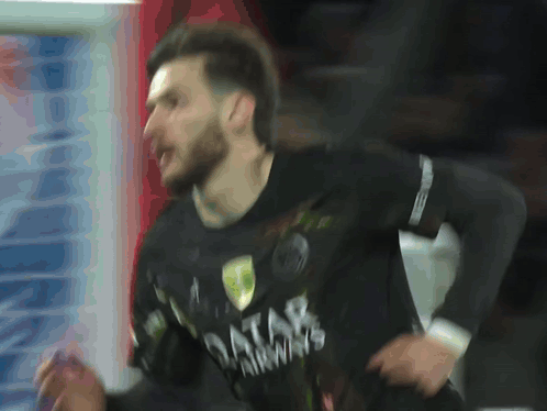 A Man Wearing A Black Qatar Airways Shirt Is Running GIF