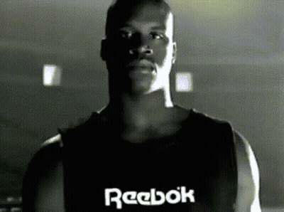 A Man Wearing A Black Reebok Tank Top GIF
