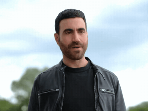 A Man Wearing A Black Shirt And A Black Leather Jacket GIF