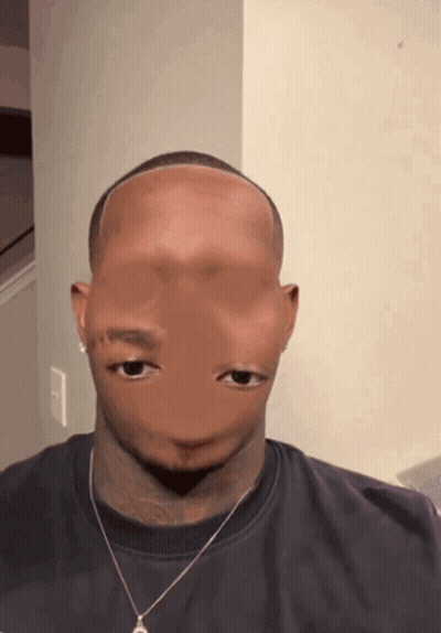 A Man Wearing A Black Shirt And A Necklace Has A Strange Face GIF
