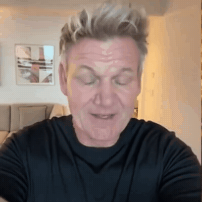 A Man Wearing A Black Shirt Is Making A Funny Face With His Eyes Closed GIF