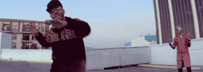 A Man Wearing A Black Shirt That Says ' A ' On It GIF