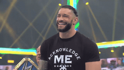 A Man Wearing A Black Shirt That Says Acknowledge Me On It GIF